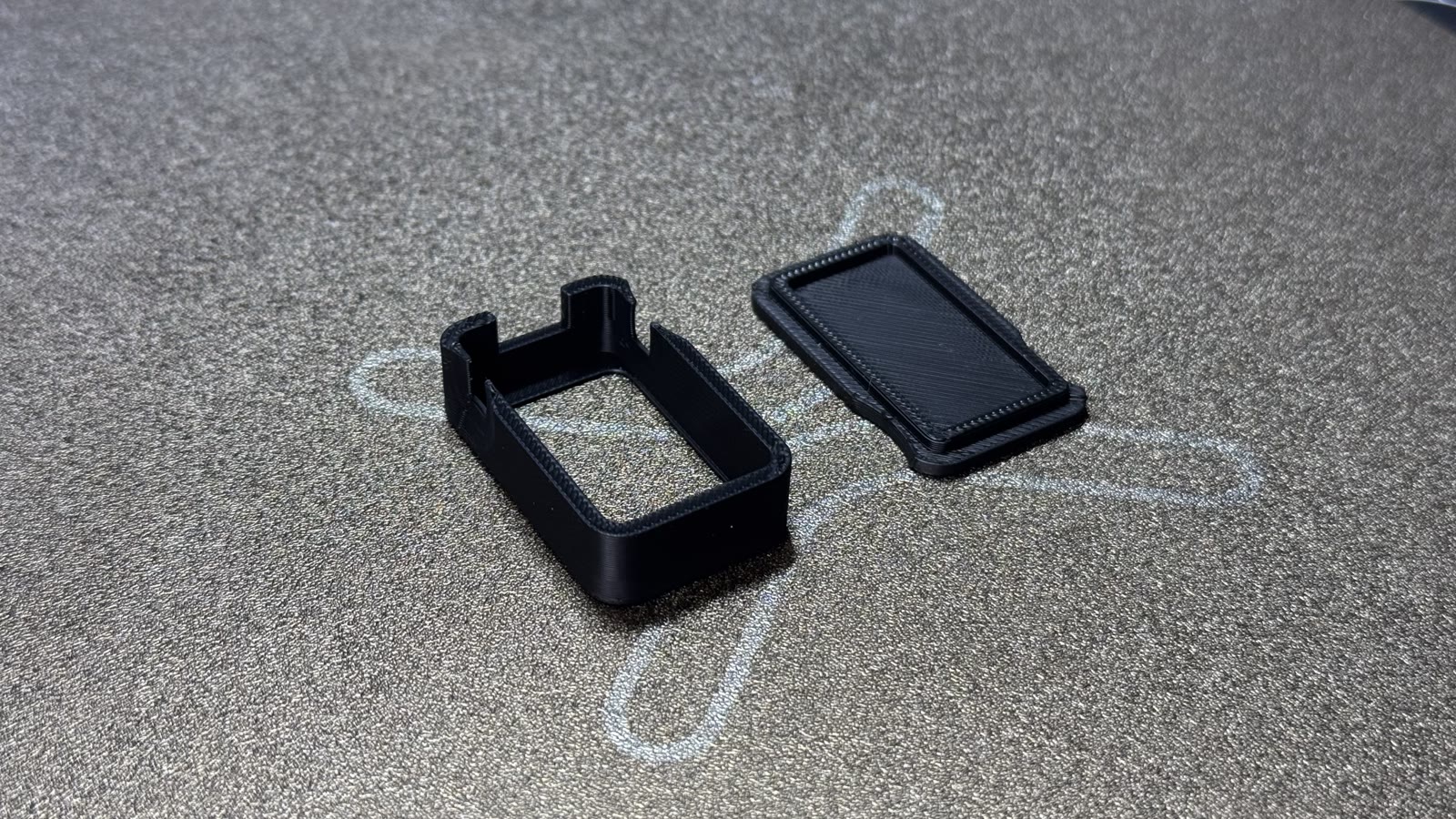 The printed frame and back lid fresh off the print bed